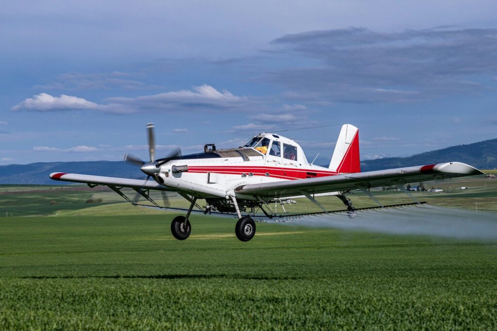 Glyphosate herbicide spraying on industrial agricultural field
