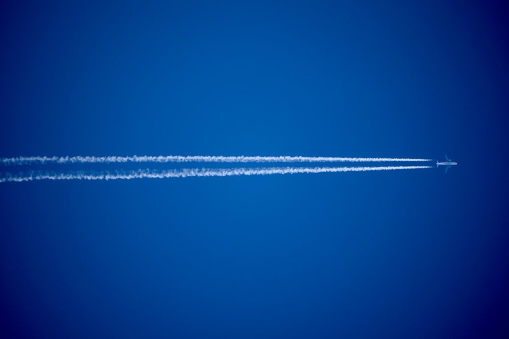 contrails, vapor trails, aircraft emissions, climate change, air quality, ozone depletion, air traffic management, flight planning, alternative fuels, weather patterns, radiative forcing,
