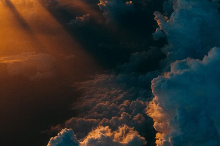 Dramatic storm clouds lit by sunlight, illustrating Europe's rising climate risk