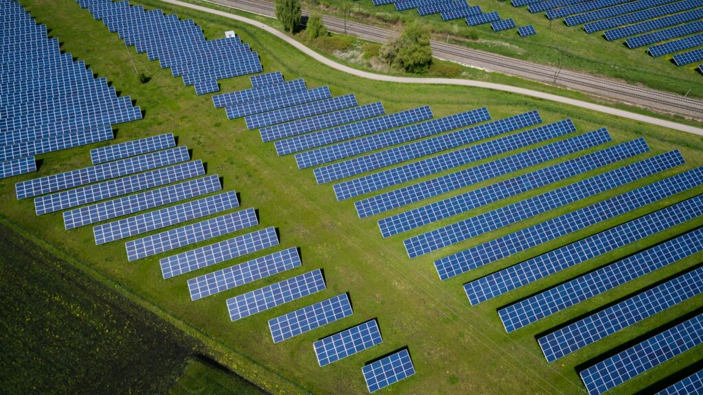 Rows of solar panels on green farmland